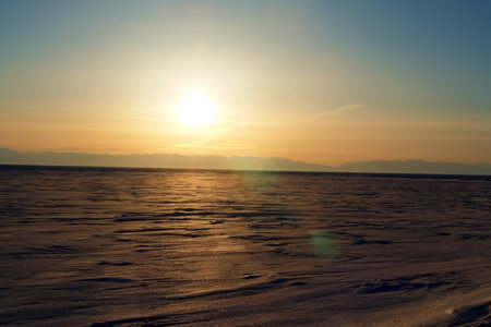 The winter landscape of Lake Baikal. Beautiful mountains in the snow and skyの写真素材
