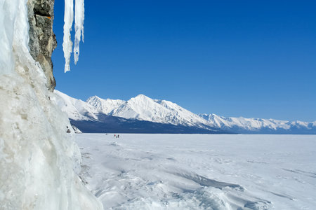 The winter landscape of Lake Baikal. Beautiful mountains in the snow and skyの写真素材