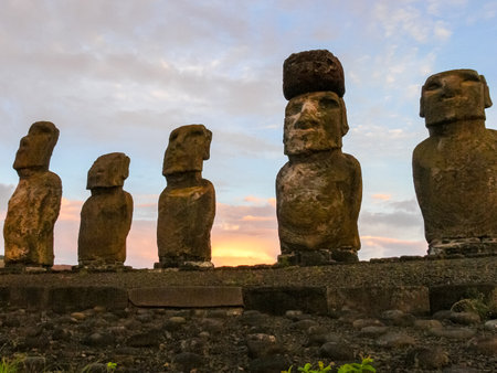 Statues of Easter Island in the background of the sunset. The melting of the Easter statue in the sunlight of the sunset.の写真素材