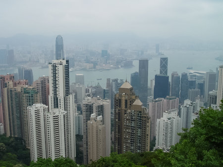 Skyscrapers of Hong Kong. The cityscape through a haze of smog over the city.のeditorial素材