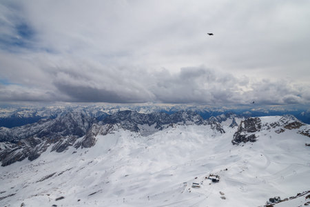 A beautiful view from the Zugspitze summit on the Alps on at spring. Bavarian Alps, Germany....