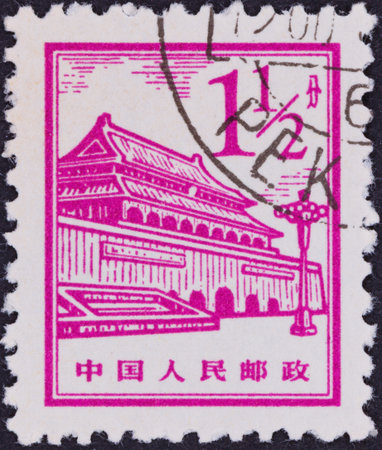 A magenta stamp features an illustration of a grand building with intricate details, a lamppost, and Chinese characters at the bottom.の写真素材