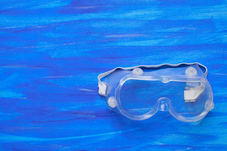 respirator medical respirator in hand on blue backgroundの写真素材