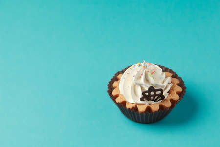 Cupcake on blue backgroundの写真素材