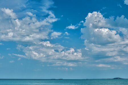 Blue sky with white clouds  over the sea, backgroundの写真素材