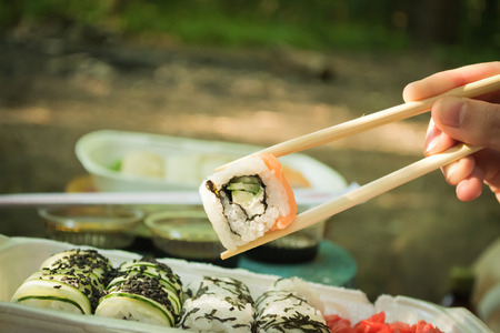 Picnic. Sushi outdoors on a summer day. Day off in the parkの写真素材