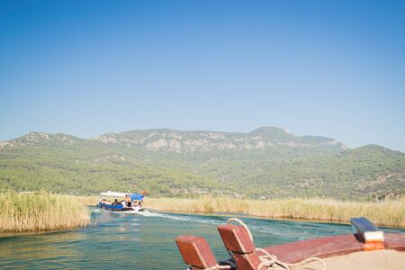 Walk on the river Dalyan, Turkey. Dalyan River connects the lake Caj?giz and the Aegean Seaの写真素材