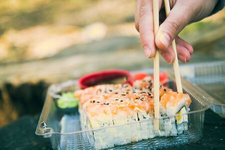Picnic. Sushi outdoors on a summer day. Day off in the parkの写真素材
