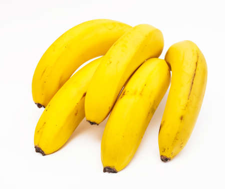 A branch of bananas closeup, isolated on white backgroundの写真素材