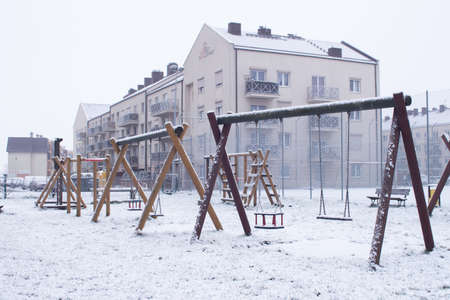 swing for children in winter. playground near the house Koscian.Poznan. 21,01,2018のeditorial素材