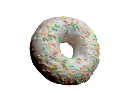 beautiful white donut with colored sprinkles. isolated on white background.の写真素材