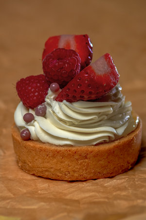 one cream cake with red berriesの写真素材