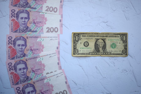 Banknote in one dollar and Ukrainian 200 hryvnia