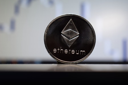 Coin silver Ethereum, digital money, cryptocurrency on a gray backgroundの写真素材