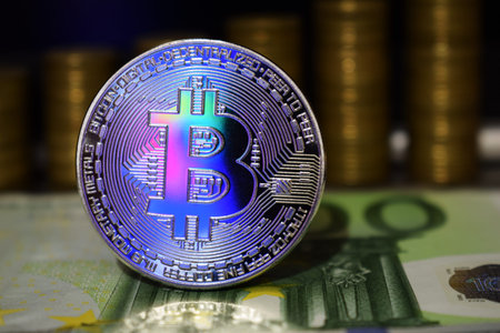 Beautiful Bitcoin BTC on the background of euro banknote and gold coins. The concept of...