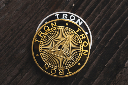 Golden coin Tron TRX, digital money, new cryptocurrency. Tron is a promising cryptocurrency.の写真素材