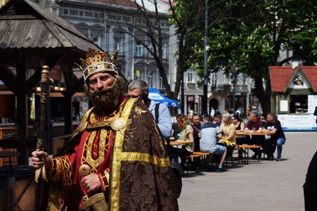 Ukraine, Lviv - May, 2019: A man in the carnival costume of King Danylo Galitsky.のeditorial素材