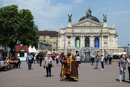 Ukraine, Lviv - May 2019: a man in the carnival costume of King Danylo Galitsky against the...