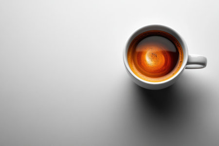 Cup of coffee on gray background, top view. Space for textの素材