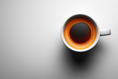 Cup of coffee on gray background, top view. Space for textの素材