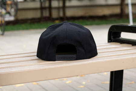 Blank snapback hat cap flat visor with black color in outdoor, ready for your mock up design or presentation your design projectの写真素材