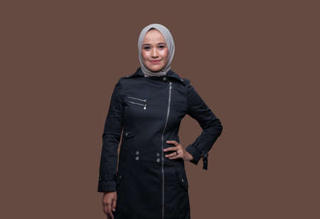 Closeup Beautiful woman wearing hijab posing on plain backgroundの写真素材