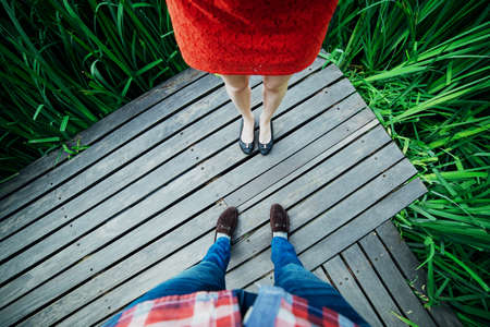 Man and woman legs top on the desk board. Abstractの写真素材