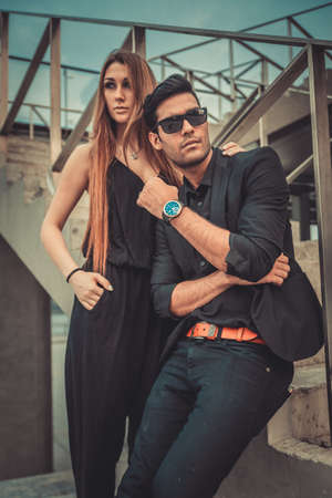 Young trendy man and woman models posing of the modern street. Fashion Styleの写真素材