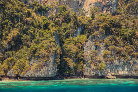 Cliff and the clear sea Phi Phi islands south of Thailand.の写真素材