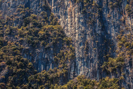 Cliff and the clear sea Phi Phi islands south of Thailand. Phi phi high rocks islands.の写真素材