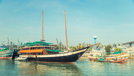 Old wreck Ship Harbor fishing and travel boat stranded. Thailand.の写真素材