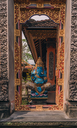 Sculpture of blue Lord Ganesha in balinese temple. Indonesian hindu god, symbol of happiness and wisdomの写真素材