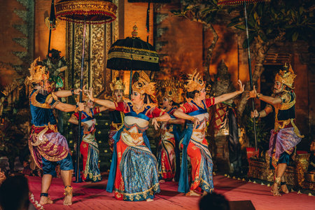 UBUD, BALI, INDONESIA - FEBRUARY 10, 2023: Traditional dance Legong and Barong in Ubud Palace is performed by local professional actors with colorful clothes, expressive gestures, facial expressionsのeditorial素材