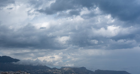 Expansive cloudy sky above South Spain mountains, capturing moody weather and scenic views. Ideal...