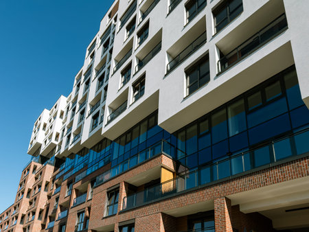 Contemporary residential architecture in South Spain featuring geometric balconies, large windows,...