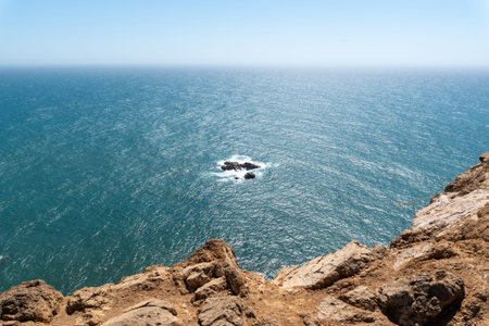Stunning view from a rugged cliff above the Atlantic Ocean near Lisbon, Portugal, perfect for...