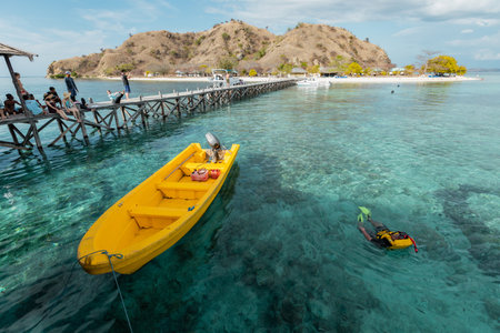 Yellow boat on the crystal clear water