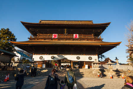 A family is walking towards the Zenkoji temple. Nagano, Japan, December 2016のeditorial素材