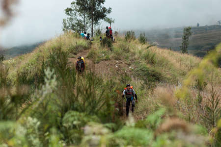 MOUNT RINJANI NATIONAL PARK, INDONESIA - JULY 22, 2016: People have rest on the hill on their way to Mount Rinjani on July 22, 2016 in Mount Rinjani National Park, Indonesiaのeditorial素材