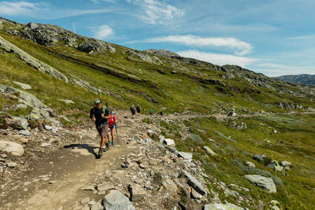 VESTLAND COUNTY, NORWAY - JULY 26, 2019: Hikers on the hiking route to Trolltungaのeditorial素材