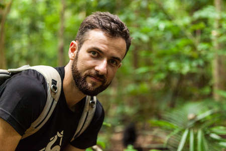 A happy tourist in the rainforest of Indonesiaの写真素材