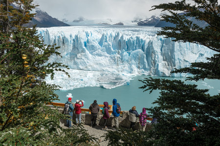 LOS GLACIARES NATIONAL PARK, ARGENTINA - JANUARY 26, 2019: Tourists at the viewing platform admiring...