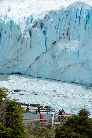 LOS GLACIARES NATIONAL PARK, ARGENTINA - JANUARY 26, 2019: A couple takes a selfie in front of Perito Moreno Glacierのeditorial素材