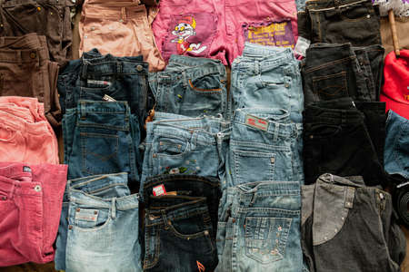 Set of jeans of different sizes and colours for sale on the street of Bangkok, Thailandの写真素材