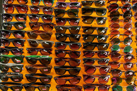 Sunglasses neatly set on the display of the street market of Bangkok, Thailand