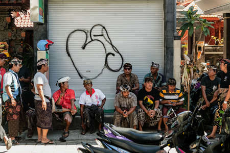 BALI, INDONESIA - MARCH 2, 2014: Group of Balinese men chit chattingのeditorial素材