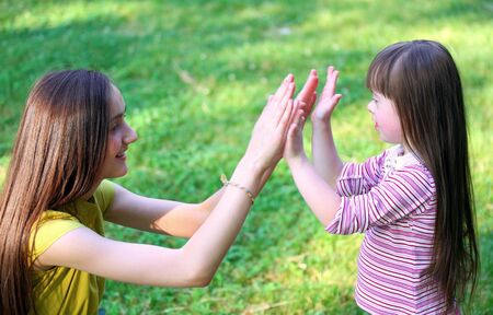 Portrait of beautiful young girls in the park .の写真素材