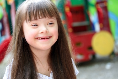 Portrait of beautiful young girl on the playgroundの写真素材