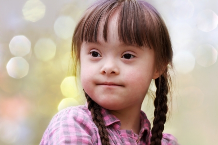 Portrait of happy young girl in the parkの写真素材