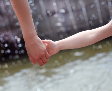 Hands of mother and childの写真素材